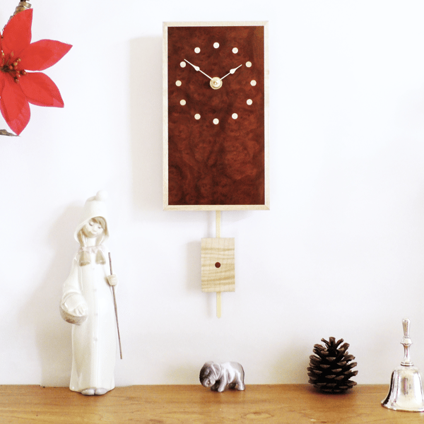 Rectangular Pendulum Wall Clock in burr madrone and sycamore with inlaid dots.