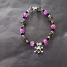 Elasticated skull and crossbones beaded bracelet 