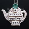 Ceramic teapot decoration with button flower