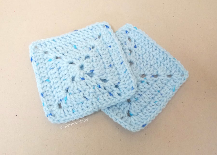 Square crochet coasters in blue, set of two.