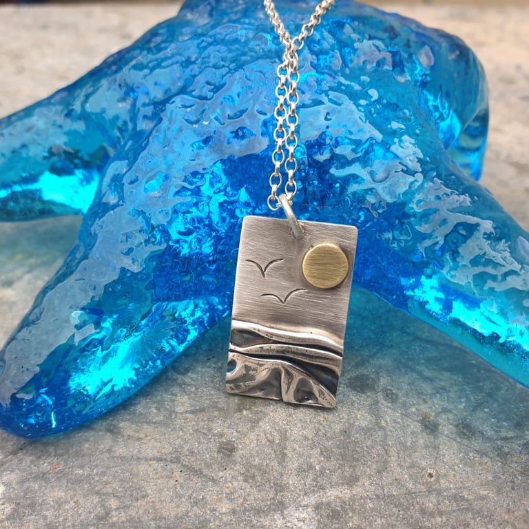 Silver beach, sea coast pendant, with brass sun and seagulls