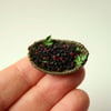 Miniature forraged blackberries in woven dish