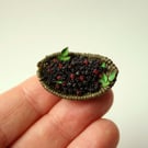 Miniature forraged blackberries in woven dish