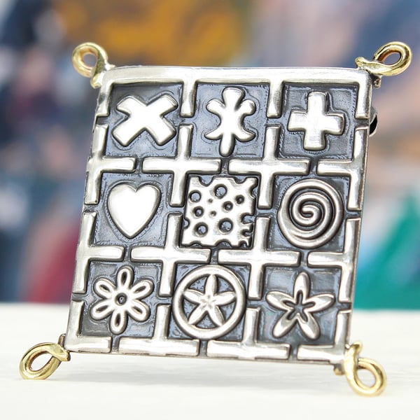 Handmade brooch, square oxidised sterling silver with embossed pattern and hoops