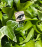 Green Glass Eye Brooch  - Image 1