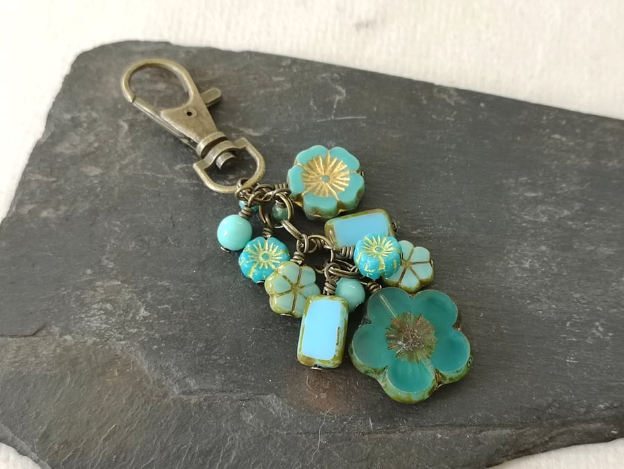 Turquoise, blue and antique gold bag charm with Czech glass beads and flowers 
