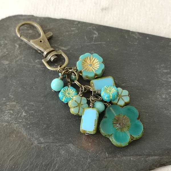 Turquoise, blue and antique gold bag charm with Czech glass beads and flowers 
