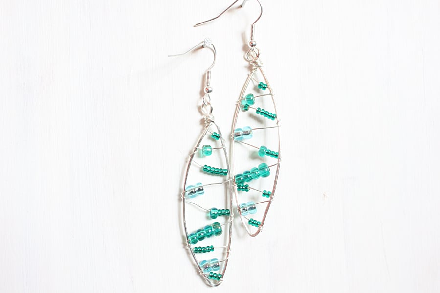 Leaf shaped silver wire wrapped drop earrings with green, blue and teal beads