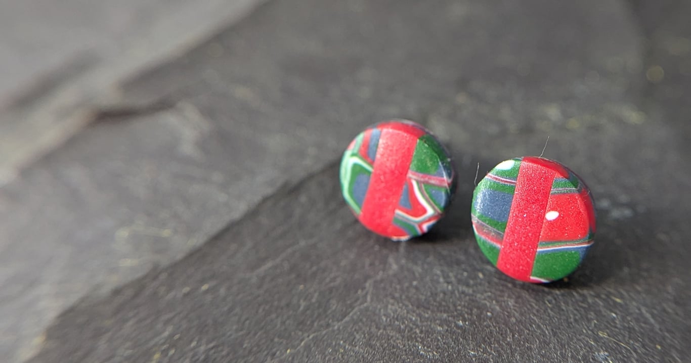 Red stud earrings with retro detail