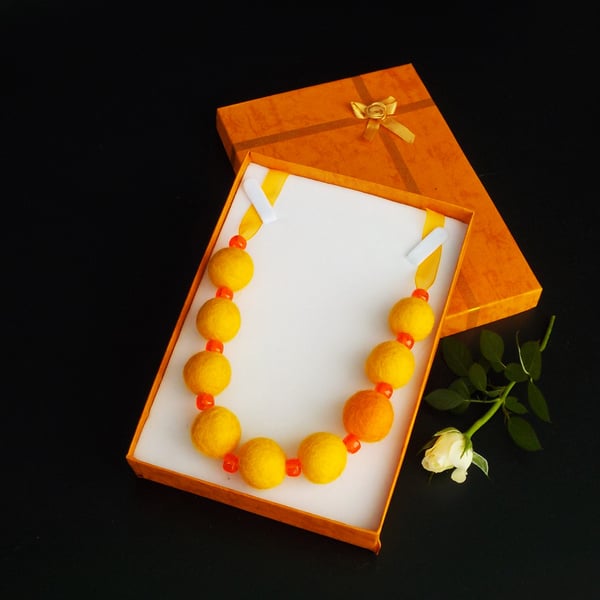 Handmade felt necklace orange beads in gift box.