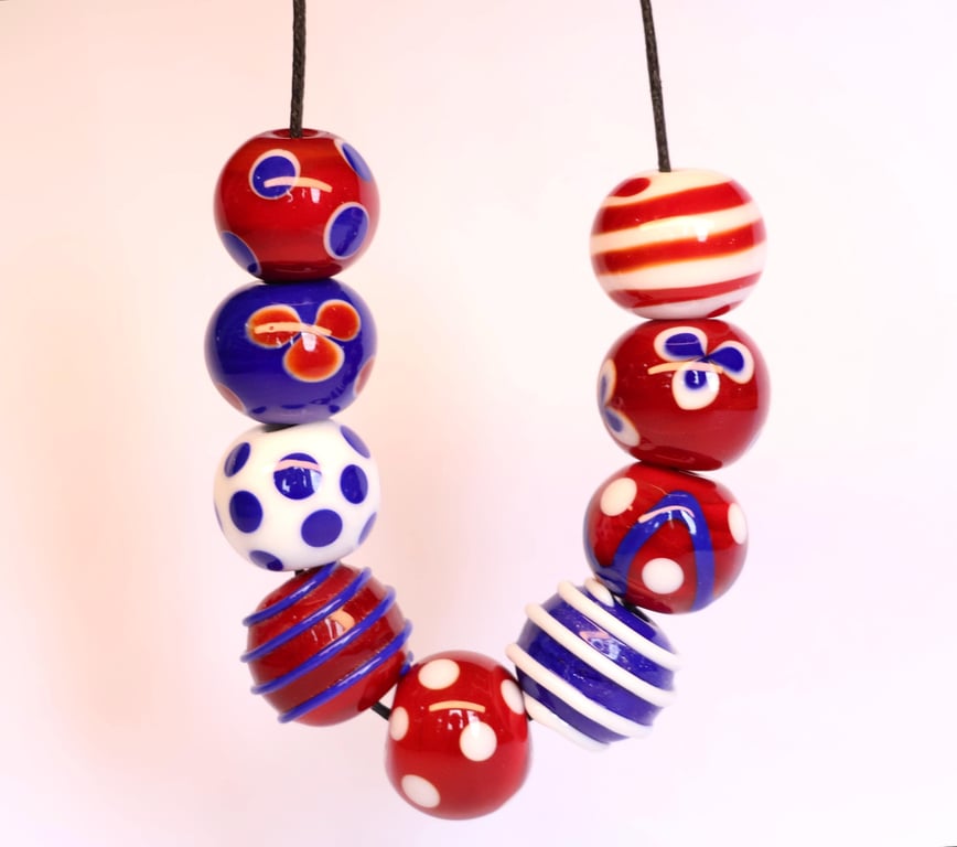 Handmade red, white and blue patterned lampwork glass beads