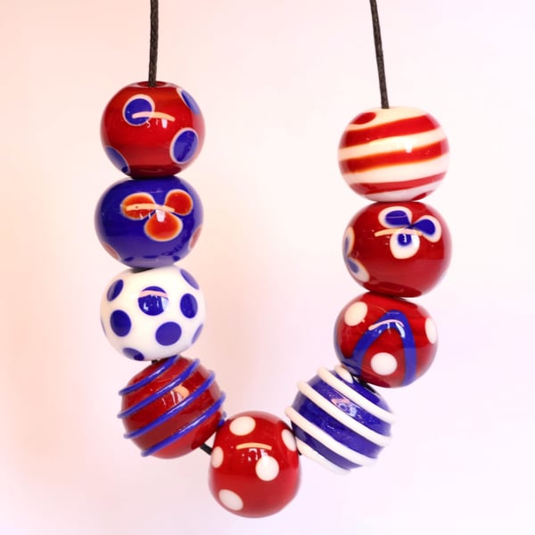 Handmade red, white and blue patterned lampwork glass beads