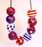 Handmade red, white and blue patterned lampwork glass beads