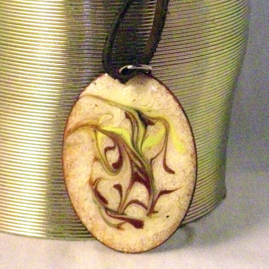 pendant - oval, scrolled brick-red and gold on cream over clear enamel