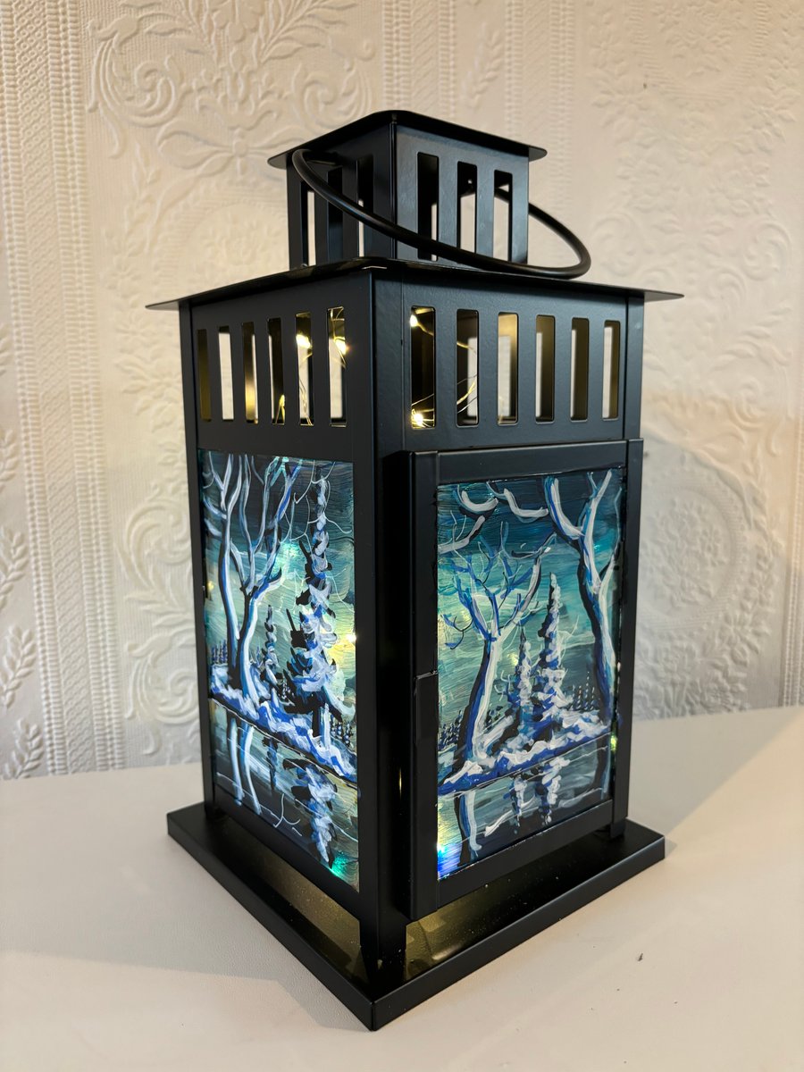 A hand painted and fired metal and glass lantern by Andrew Jenkins 