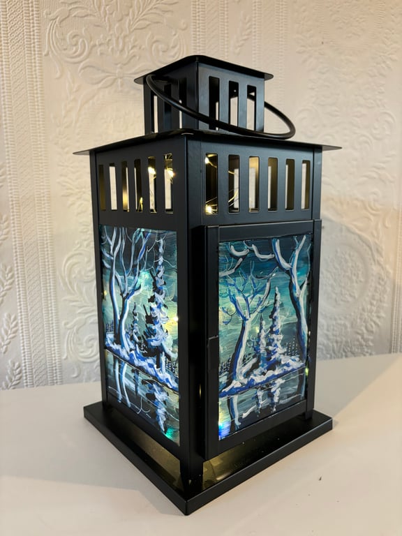 A hand painted and fired metal and glass lantern by Andrew Jenkins 