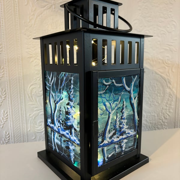 A hand painted and fired metal and glass lantern by Andrew Jenkins 