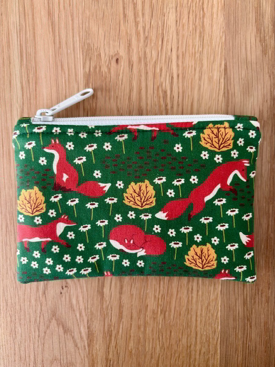 Small zipped fabric purse, pouch, make up bag, green with fun foxes print.