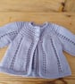 Baby cardigan handmade in lavender 100% merino wool for 3-6 months.