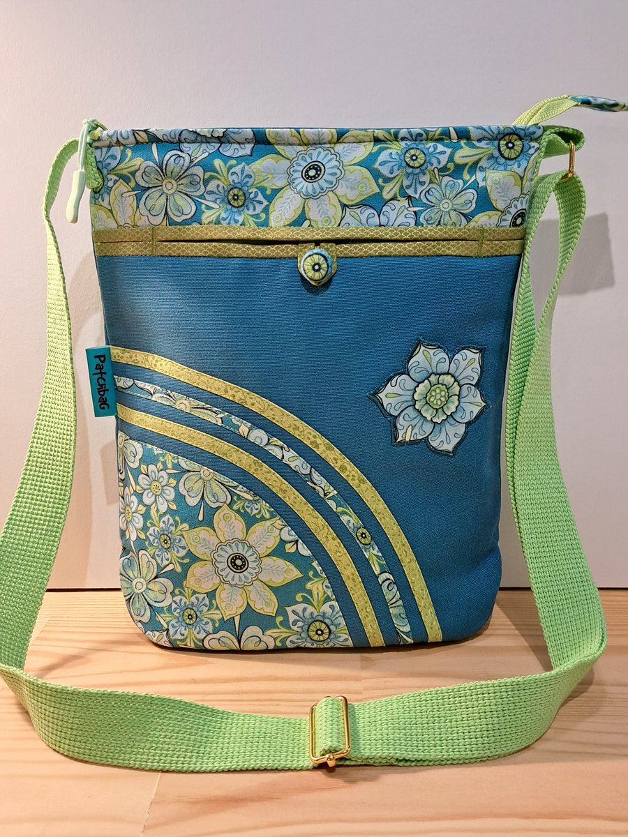 Teal handbag with lime flowers 