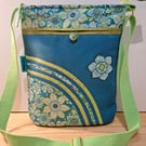 Teal handbag with lime flowers 