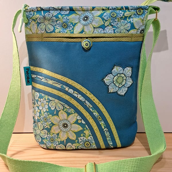 Teal handbag with lime flowers 