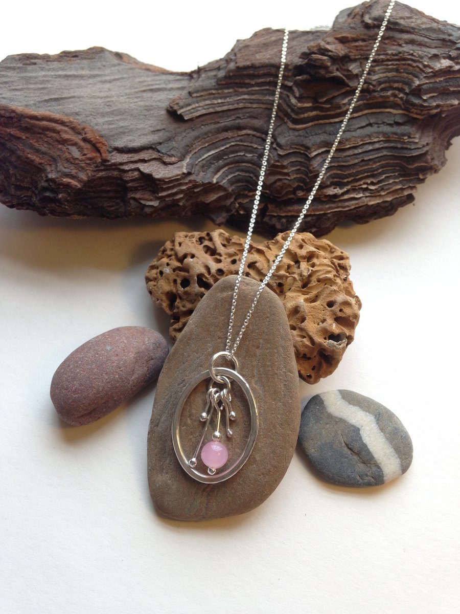 Sterling Silver Pendant. Oval Ring with stamen detail and Rose Quartz bead