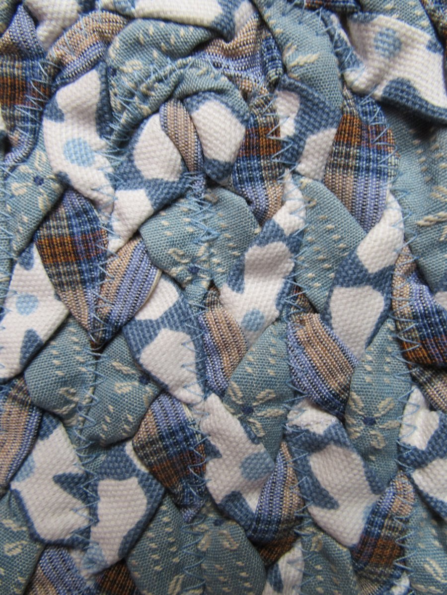 Hand made hand braided slate grey oval rug