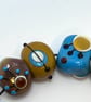 Handmade brown, ivory and turquoise patterned lamp work glass beads - Image 2
