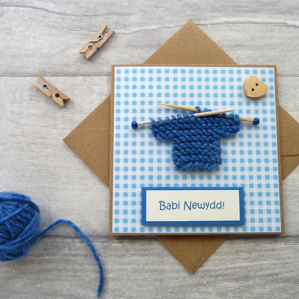 Babi Newydd Small New Baby Card with little knitted jumper in Welsh 4" x 4"