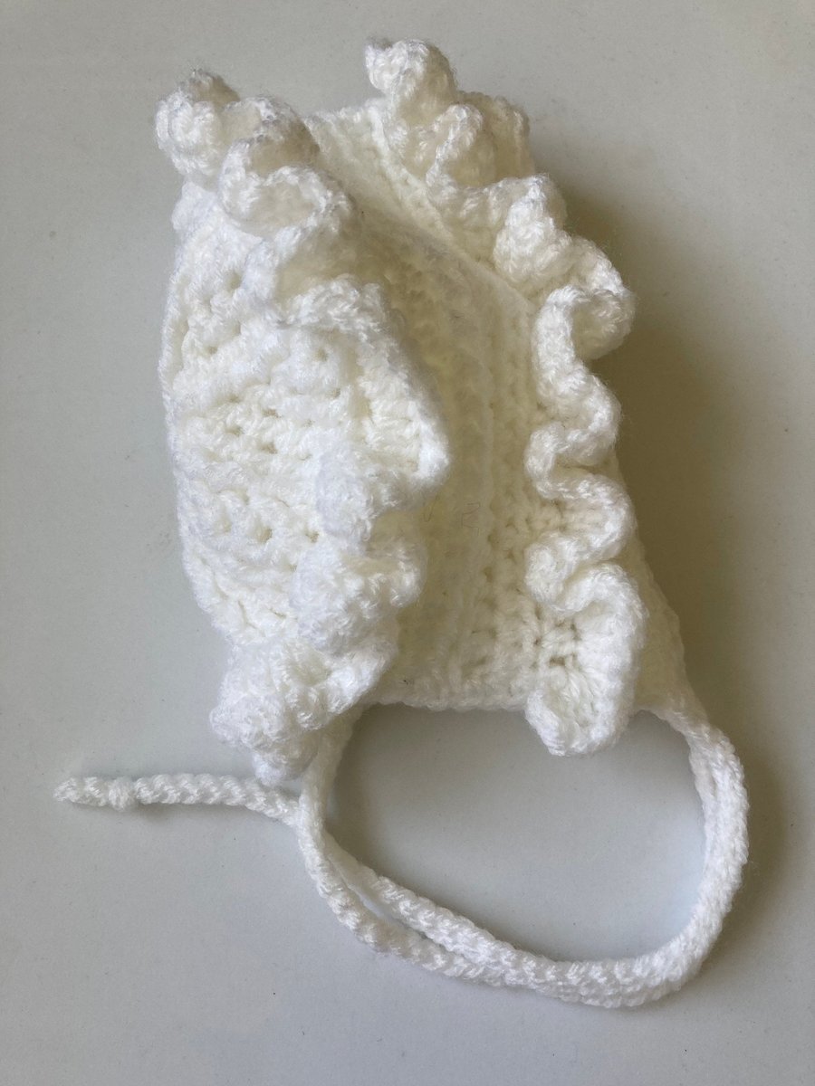 348-137. Crochet frilly bonnet..