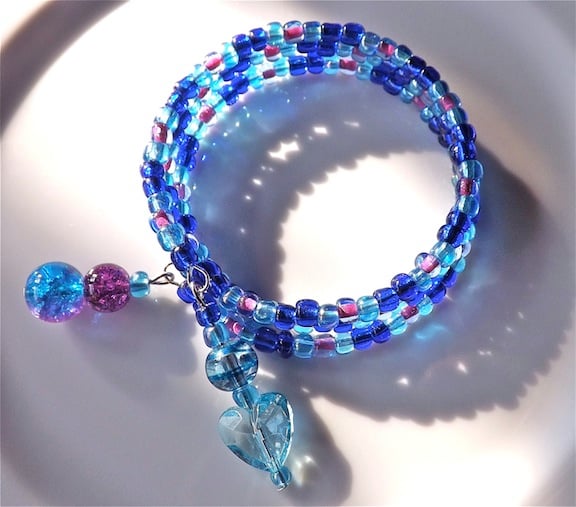 Blue rainbow glass bead bangle bracelet. blues and mauves.