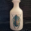 Thrown porcelain vase with beetle design