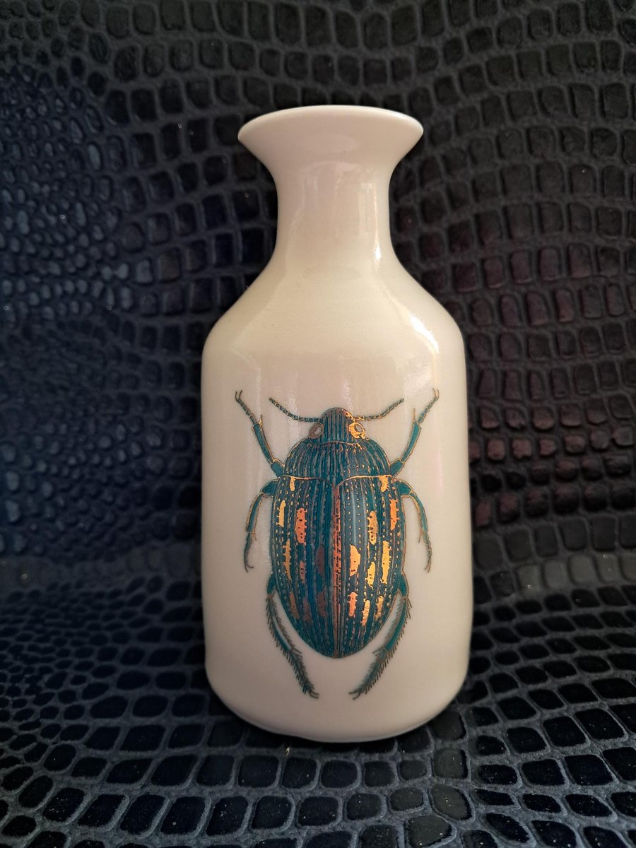 Thrown porcelain vase with beetle design