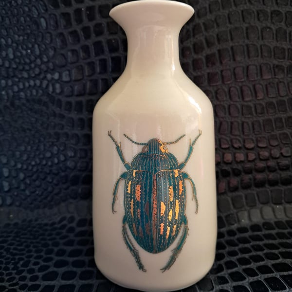 Thrown porcelain vase with beetle design