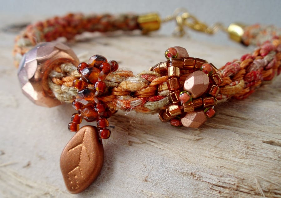 Hand braided Kumihimo bracelet with Copper beaded charms