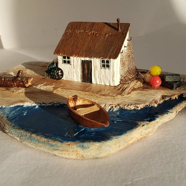 Fishing bothy driftwood house and boat scene.