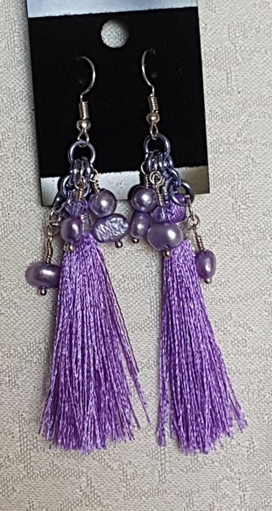 Gorgeous Purple tassel earrings with lilac pearls.