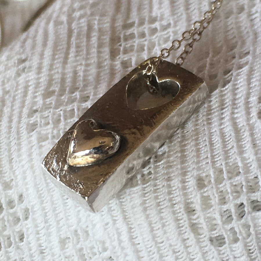 Silver cut out heart tag pendant