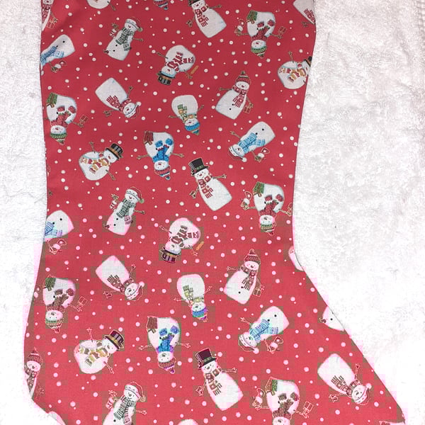 Colourful snowmen on red Christmas stocking