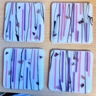Set of 4 pink and mauve glass coasters