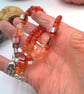 Silver Skull Pendant on an Orange Red Purple & Pink Shell Beaded Necklace - Image 3