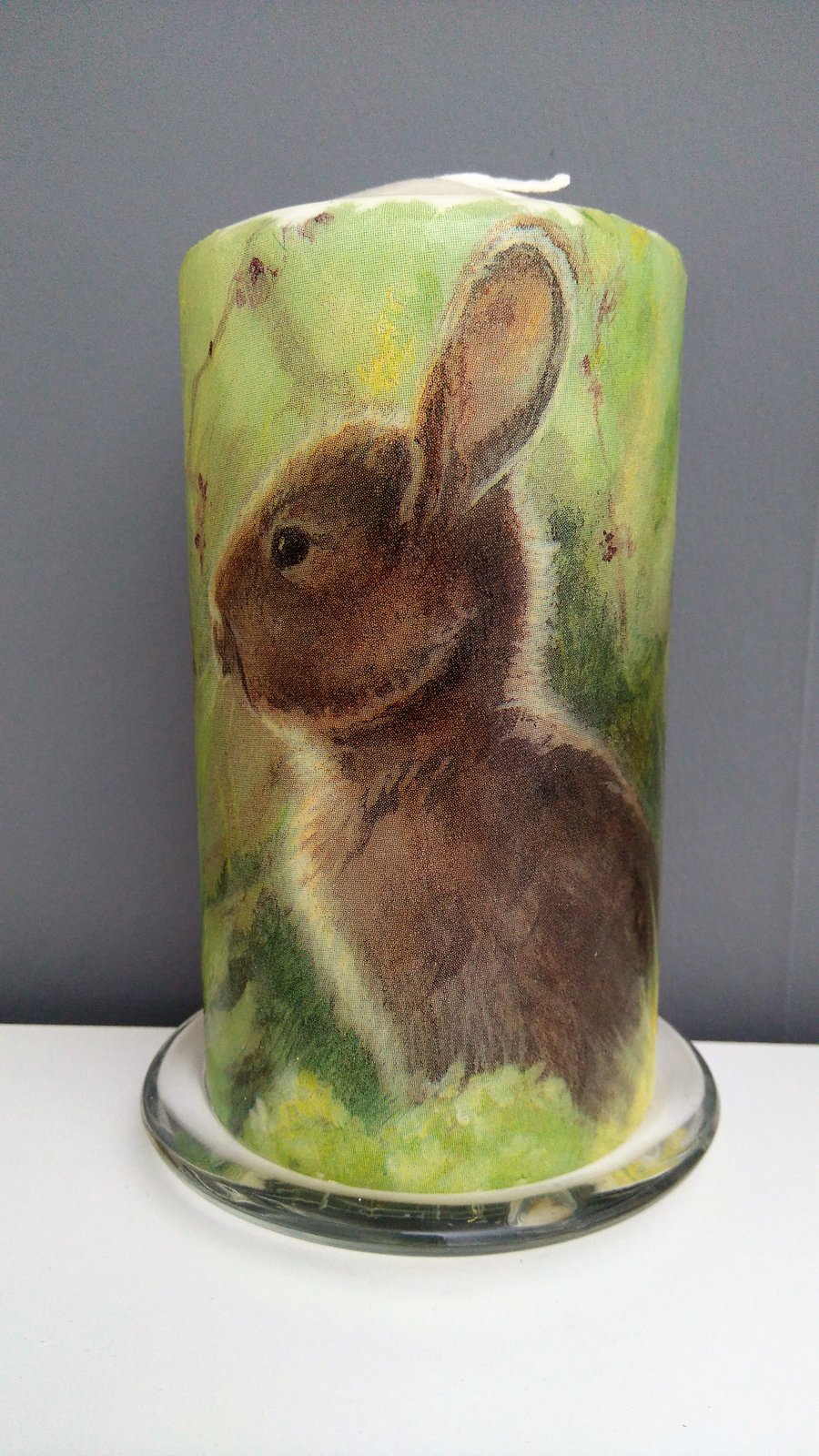 rabbit in meadow candle