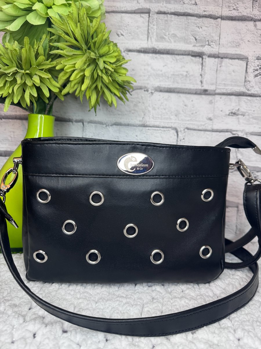Crossbody bag in Black faux leather with eyelet detail