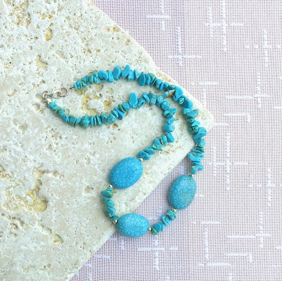 Necklace of turquoise natural stone chips with three focal beads