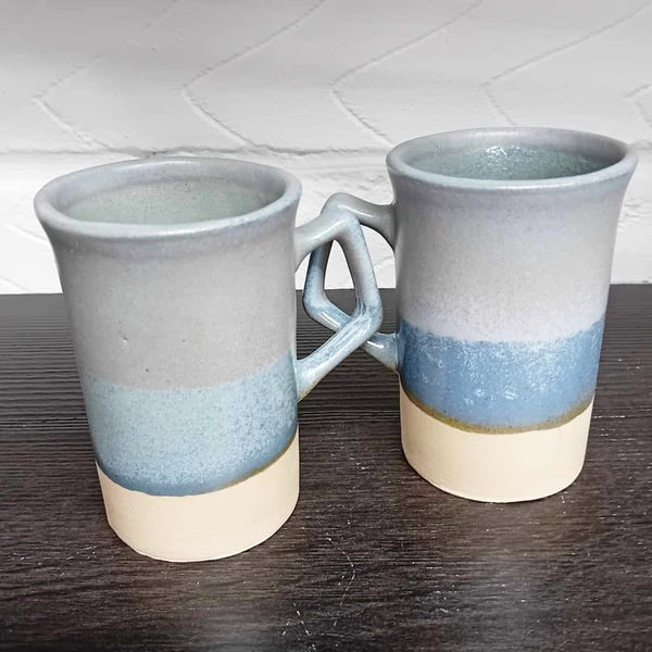 Mug Pair of Elegant Shaped with a Satin Blue glaze, shiny white interior. 
