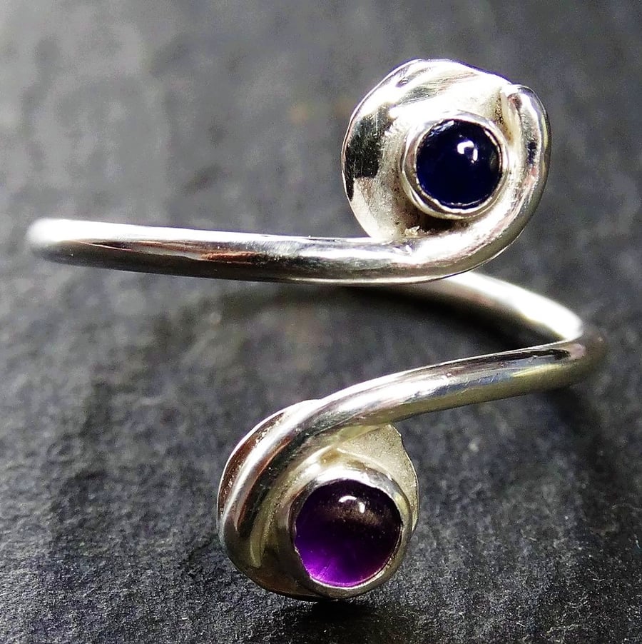 Small Tristan ring, with sapphire and amethyst. Sterling silver adjustable. 