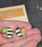 Stud earrings featuring monochrome strips and hot pink marble effect - Image 1