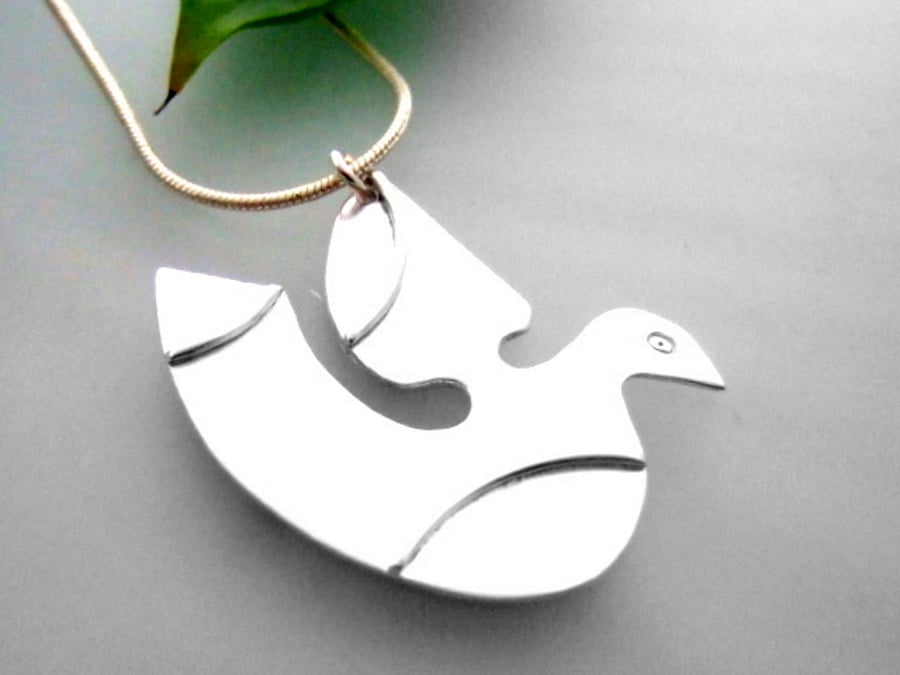 Stylised pigeon in flight pendant 