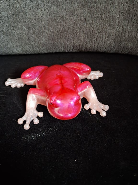 Handmade epoxy resin frog ornament. Pale pink and cerise shimmer